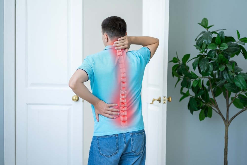 Lumbar,And,Cervical,Spine,Hernia,,Man,With,Back,Pain,At